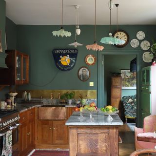 Vintage style kitchen with wooden units, copper sink, mixed glass lampshades