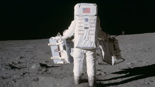 Astronaut Edwin (Buzz) Aldrin deploys two scientific experiments on the surface of the moon during Apollo 11. 