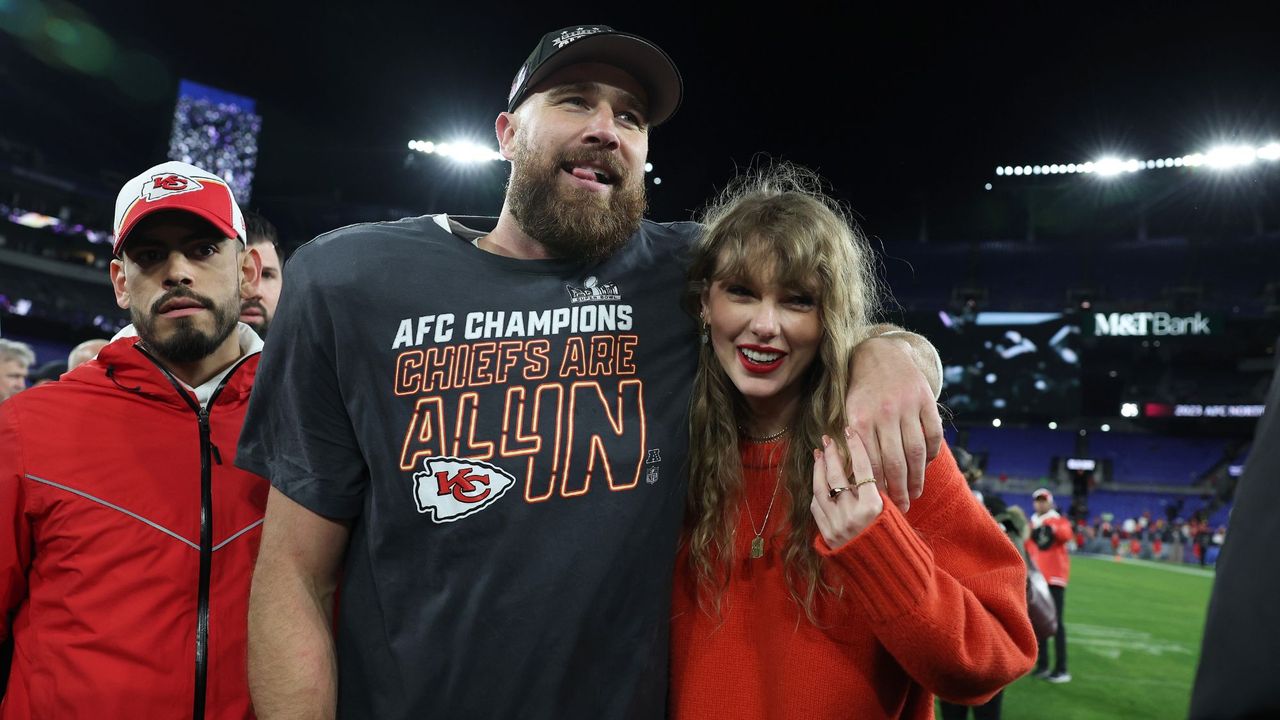 Taylor Swift and Travis Kelce smile together after a Kansas City Chiefs game