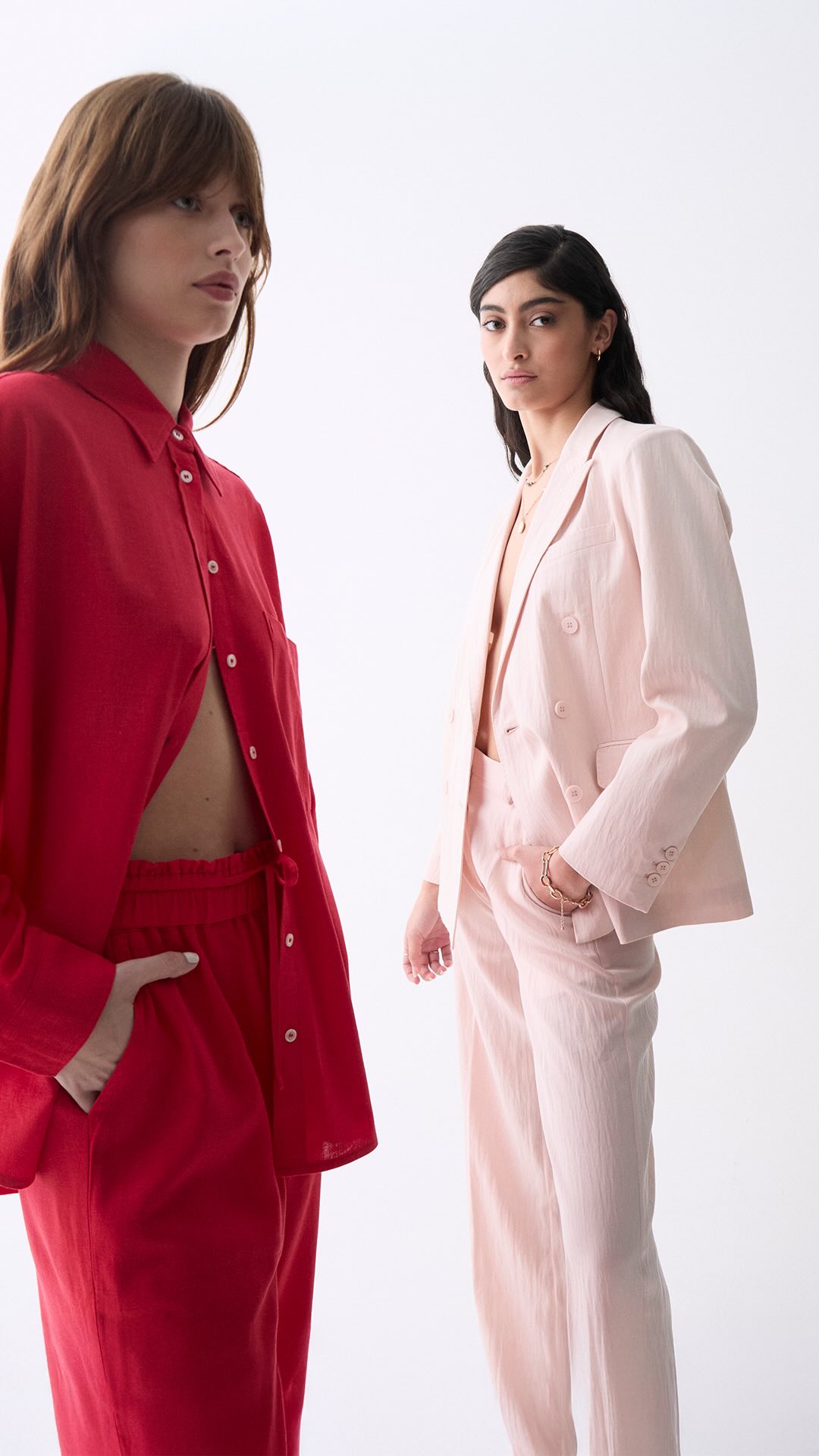 Two women wearing clothing from Dèluc.
