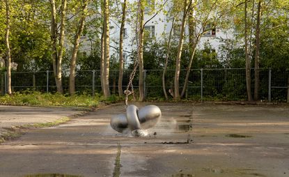 Silver art sculpture in outdoor space