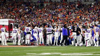 Buffalo Bills and Cincinnati Bengals players react to an injury sustained by Damar Hamlin #3 of the Buffalo Bills during the first quarter of an NFL football game against the Cincinnati Bengals at Paycor Stadium on January 2, 2023 in Cincinnati, Ohio.