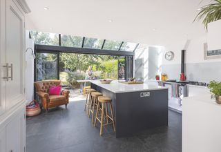 black and white kitchen with glass extension