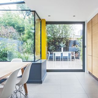 big glass window with outside seating area