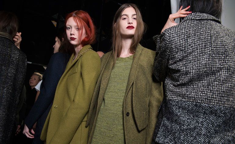 Female models dressed in the Max Mara A/W 2014 backstage of the fashion show