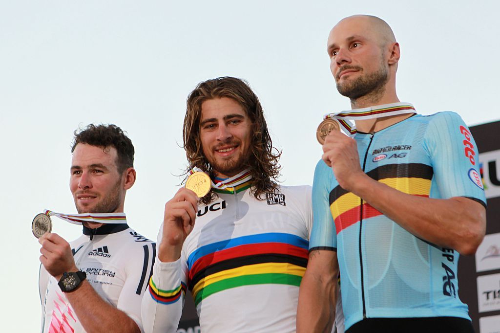 From L to R Britains silver medallist Mark Cavendish Slovakias gold medallist Peter Sagan and Belgiums bronze medallist Tom Boonen celebrate on the podium at the end of the mens elite road race event as part of the 2016 UCI Road World Championships on October 16 2016 in the Qatari capital Doha AFP KHALED DESOUKI Photo credit should read KHALED DESOUKIAFP via Getty Images
