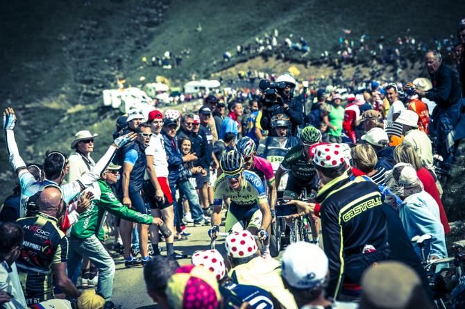 On the summit of the Port de Bales, Stage winner Michael Rogers Tinkoff Saxo Bank ahead of Lampre J R Serpa and Thomas Voeckler team Europcar.