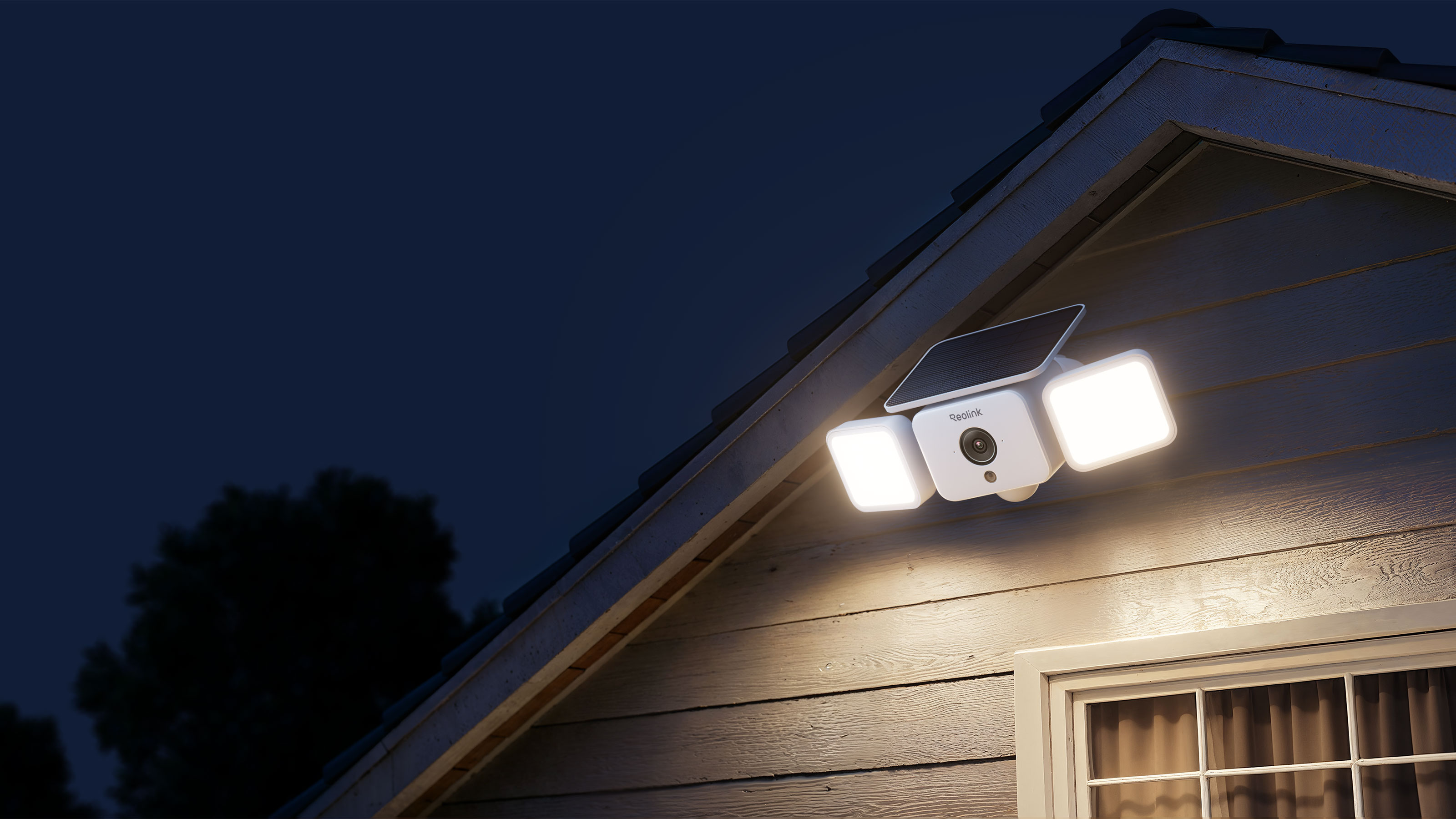Reolink solar security camera on exterior of house at night