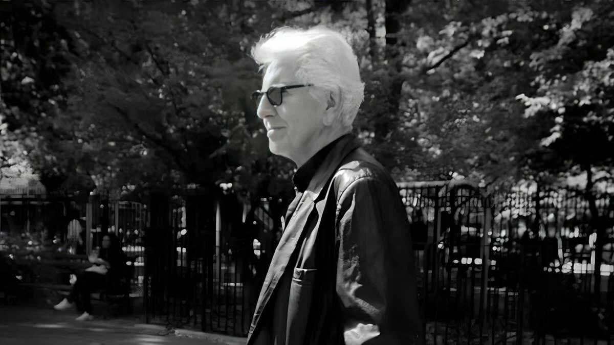 Graham Nash in sunglasses in a park