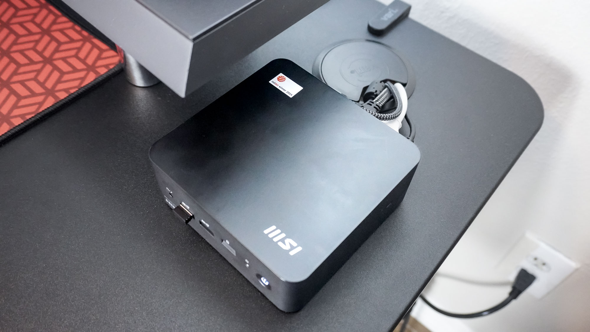 An overhead view of the MSI Cubi NUC 1M mini PC on a desk