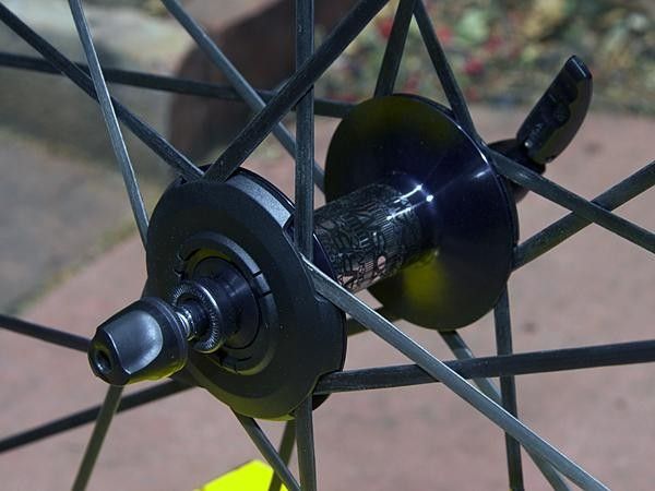 The hubs can be made lighter, too, since the spokes don't really anchor there anymore.