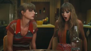 Taylor Swift sitting next to Taylor Swift, one looking ill the other shocked in the Anti-Hero video.