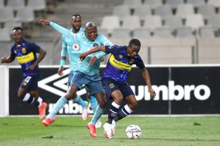 Kabelo Dlamini of Orlando Pirates and Thabo Nodada of Cape Town City challenge for possession 