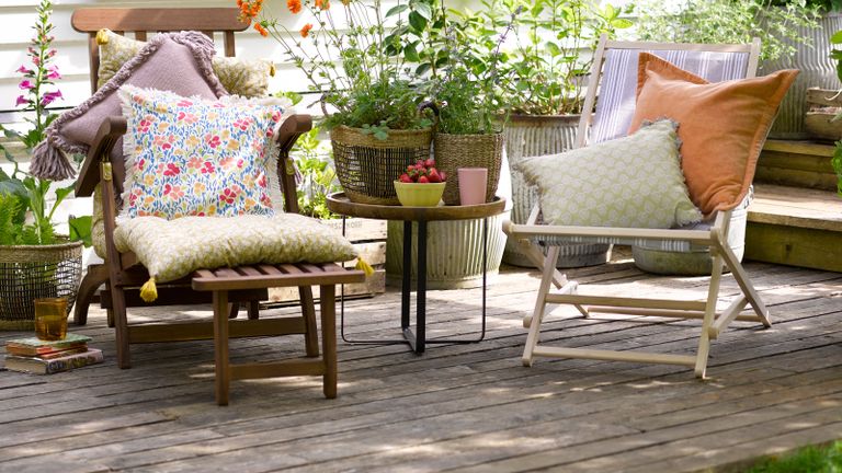 timber deck with two chairs and a table