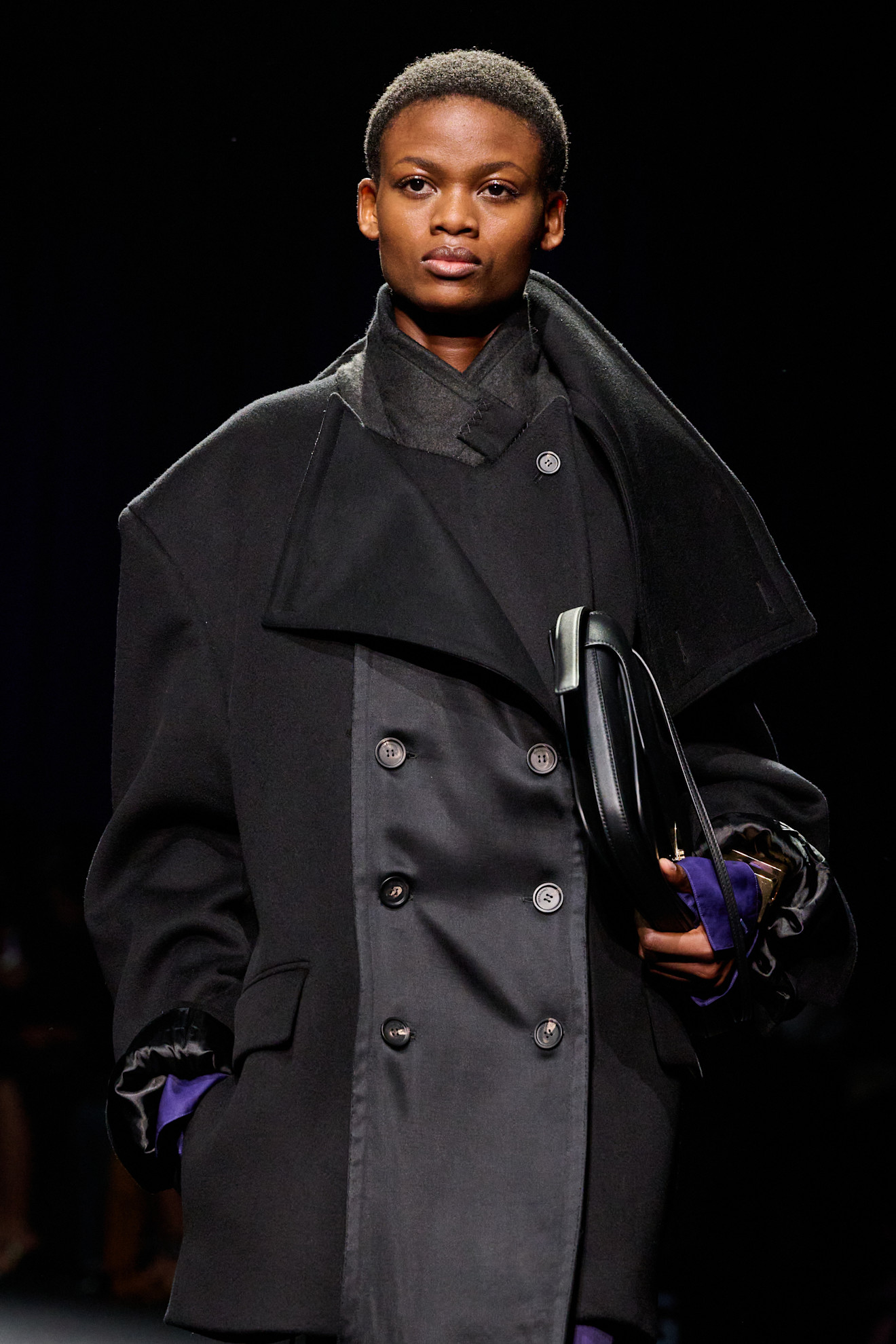 Model wears colourful cuffs on the A/W 26 runway