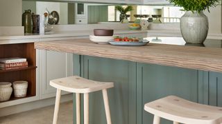 Limed oak kitchen countertop in sage green kitchen showing key kitchen trends 2023