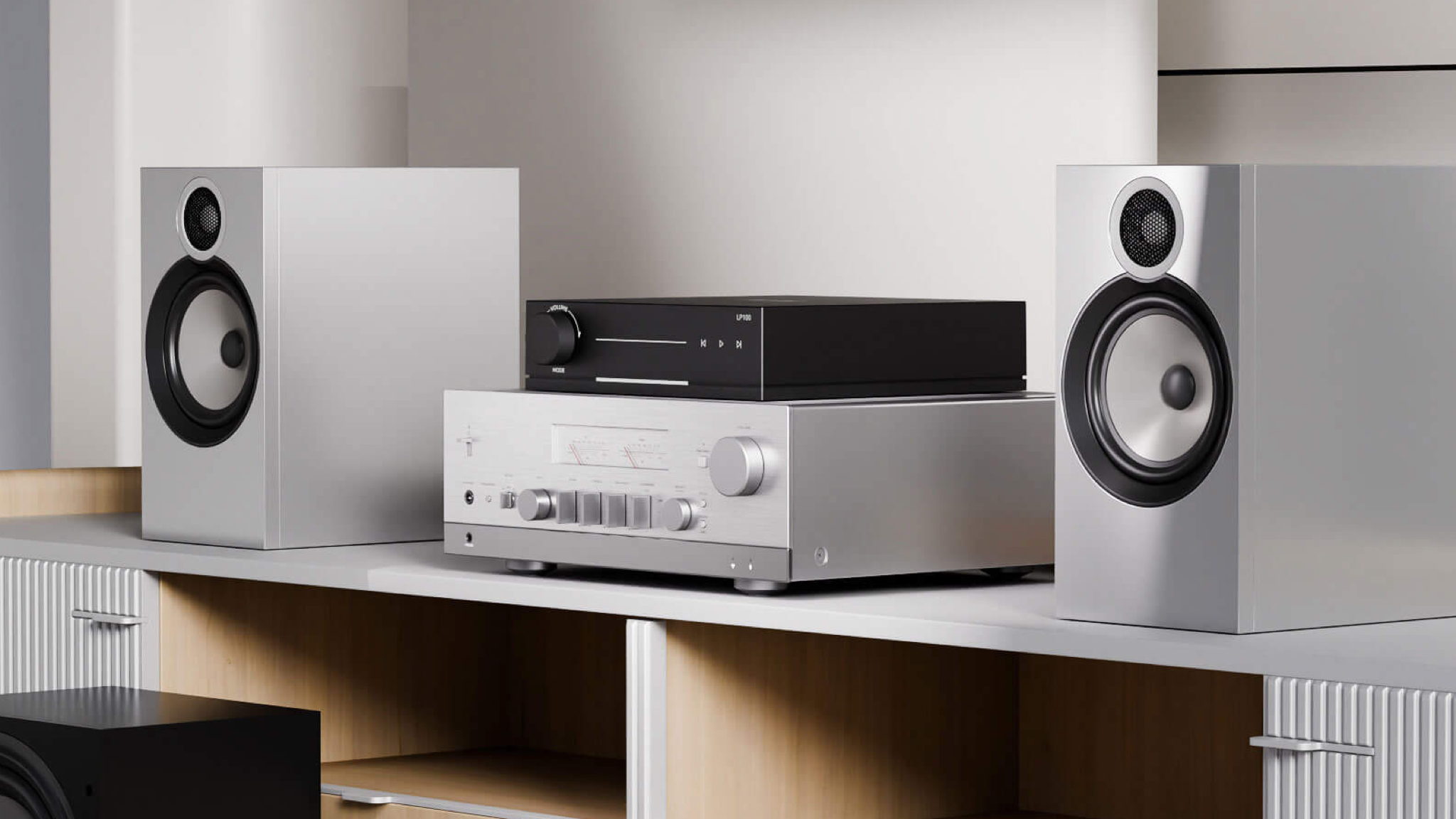 Lifestyle photo of the Arylic LP100 streamer on top of a light silver coloured hifi system