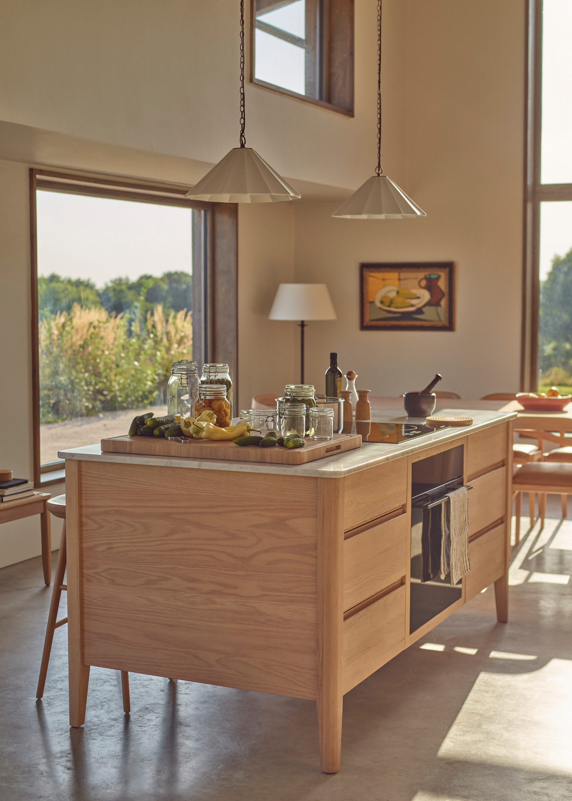 freestanding wooden island in a large white kitchen extension