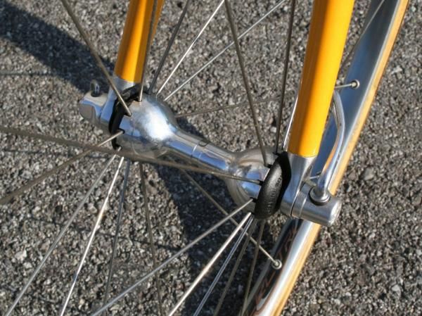 The polished alloy Campagnolo Electron front hub includes a central grease port for easy servicing.