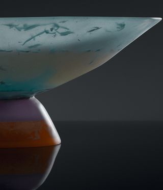 Marble coloured bowl against a dark background