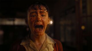 Girl screaming with blood on face in IT: Welcome To Derry