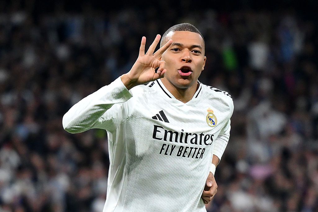 Kylian Mbappe of Real Madrid celebrates scoring his team&#039;s third goal and his hat trick with teammate Jude Bellingham during the UEFA Champions League 2024/25 League Knockout Play-off second leg match between Real Madrid C.F. and Manchester City at Santiago Bernabeu Stadium on February 19, 2025 in Madrid, Spain. 