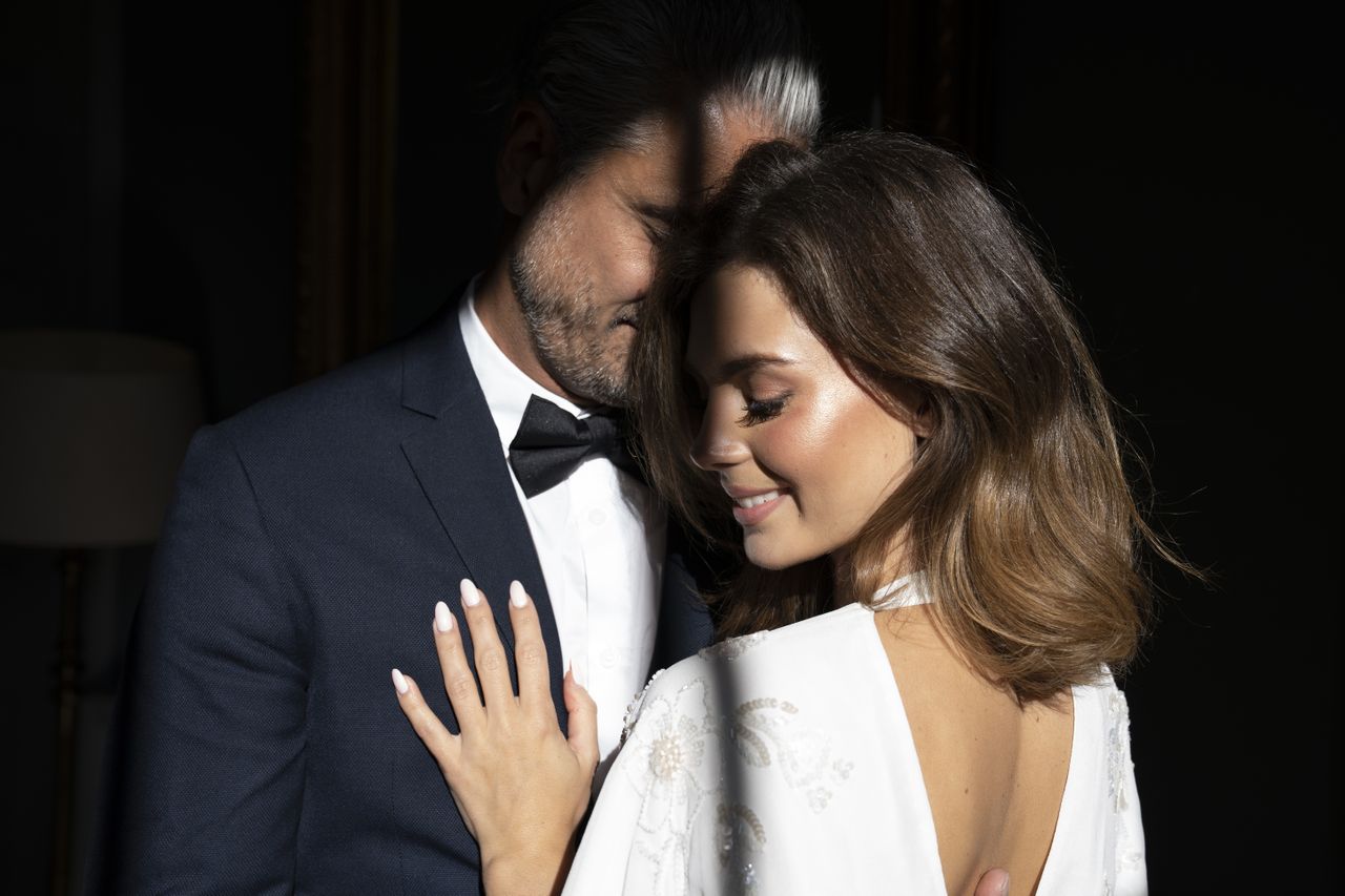 A bride and groom embracing