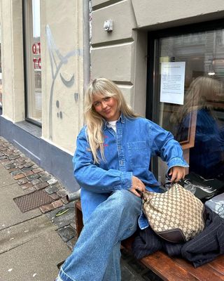 Instagram Trends 2024: Grace sports her double denim outfit with a chic shoulder bag.