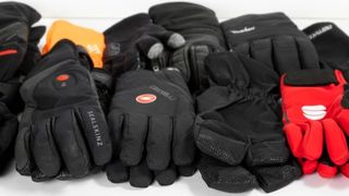 Lots of gloves of different colours and brands
