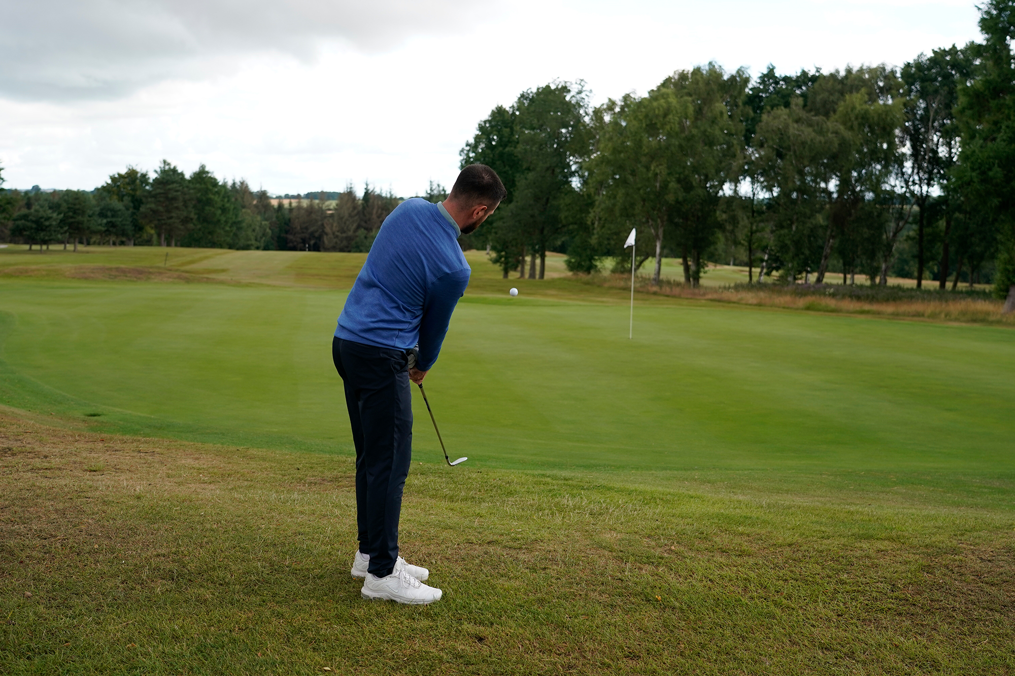 Baz Plummer hitting a short game chip shot from around the green, an area that his performance data says he excels in when compared to a 20-handicap benchmark average