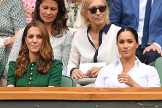 Catherine, Duchess of Cambridge and Meghan, Duchess of Sussex in the Royal Box on Centre Court