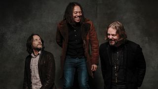 Ford (left) and Robinson flank Magpie Salute vocalist John Hogg