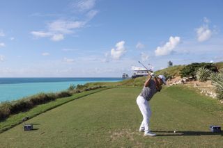 A golfer tees off at the 16th hole during the Butterfield Bermuda Championship