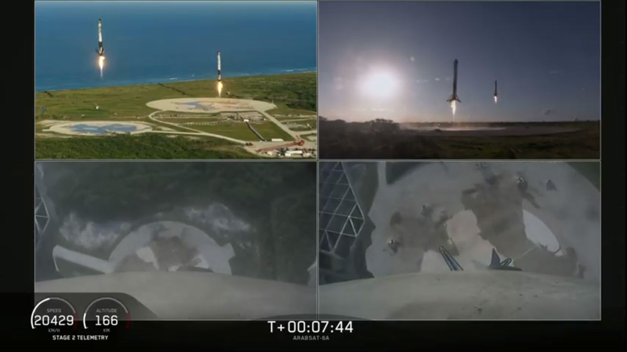 The twin Falcon Heavy side boosters make a simultaneous landings at Cape Canaveral Air Force Station in Florida after launching the Arabsat-6A satellite into orbit from NASA's Kennedy Space Center in Florida on April 11, 2019.