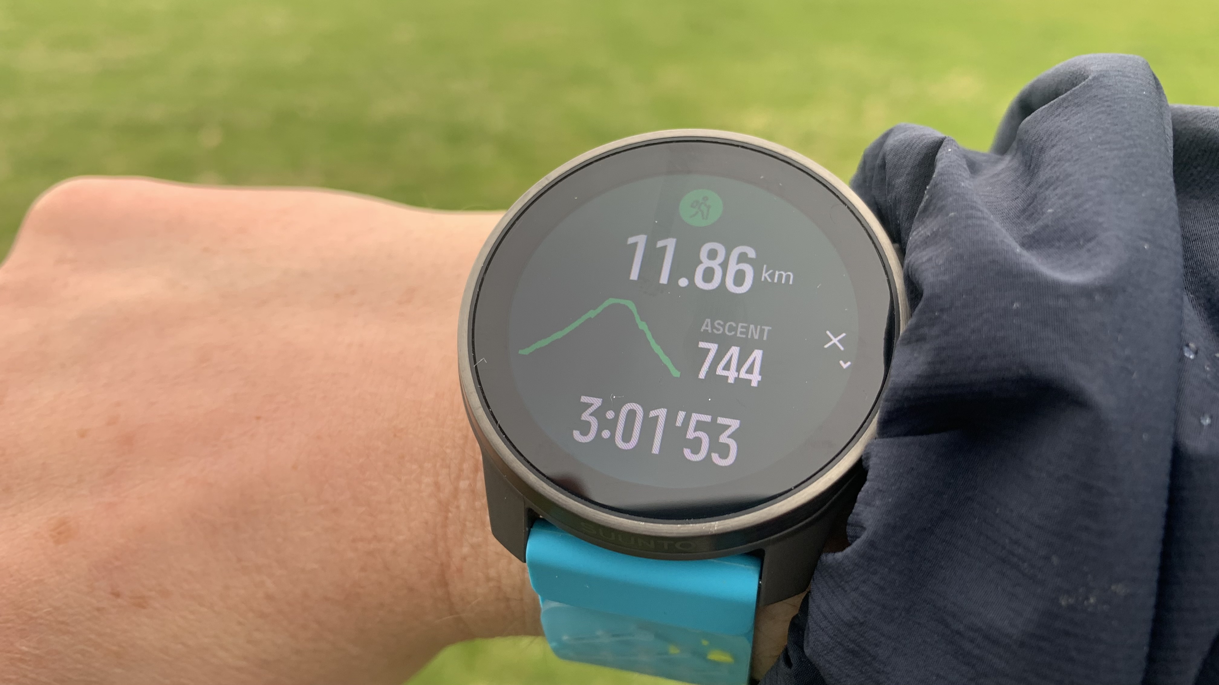 The Suunto Race S watch on wrist showing hike details