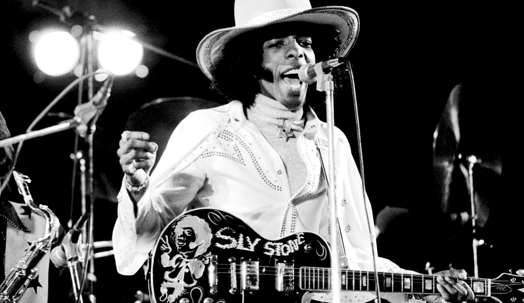 Sly Stone leads Sly &amp; the Family Stone onstage at White City Stadium in London on July 15, 1973