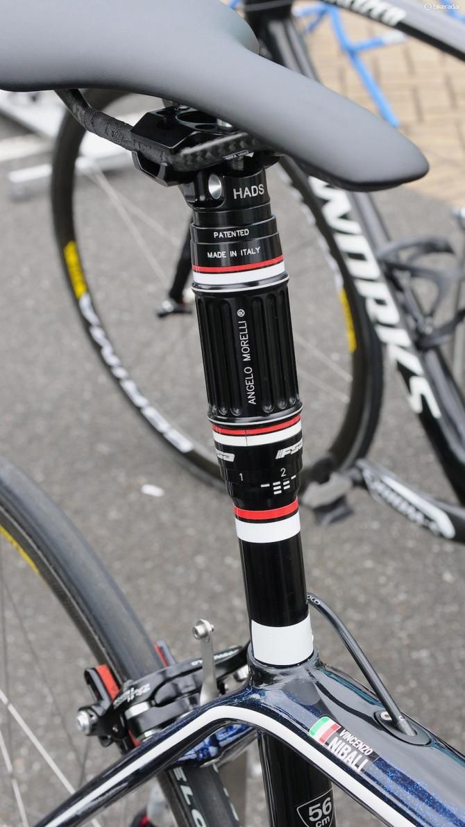 Vincenzo Nibali has this height-adjustable post on one of his bike. By turning the thick part with one hand, he can drop the saddle about 1cm