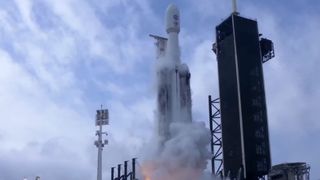 rocket lifting off with hardware about