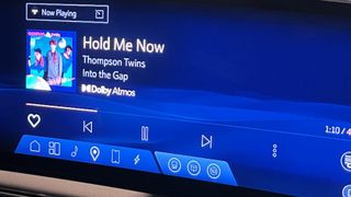 The Tidal app screen on the Cadillac OPTIQ showing Thompson Twins track