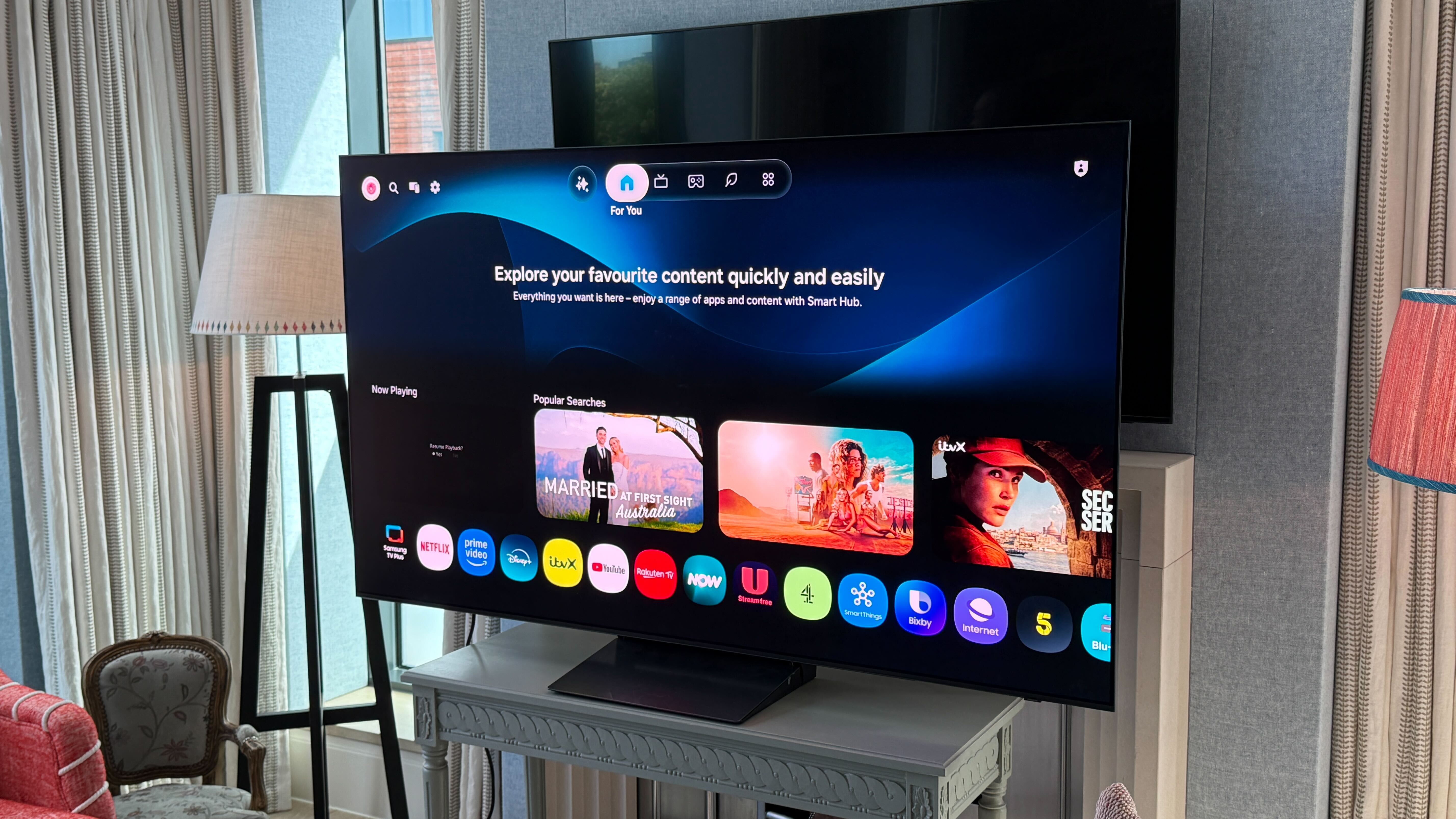 Samsung S90H in a modern hotel setting