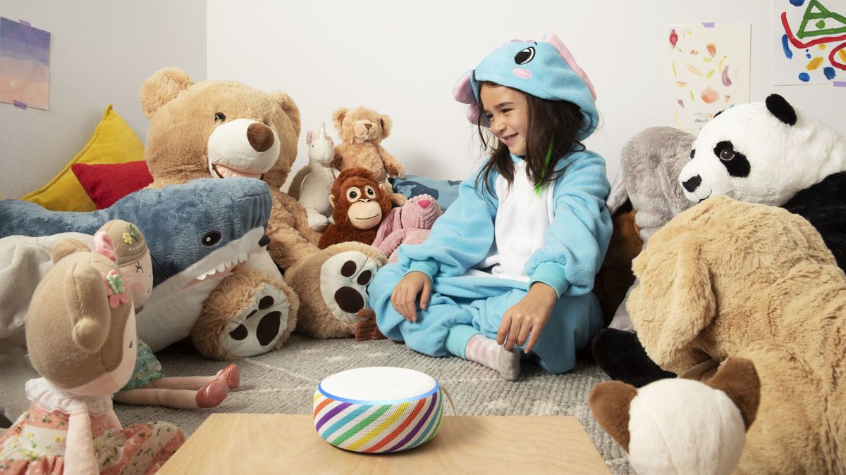 Child surrounded by teddies with an Amazon Echo Dot smart speaker