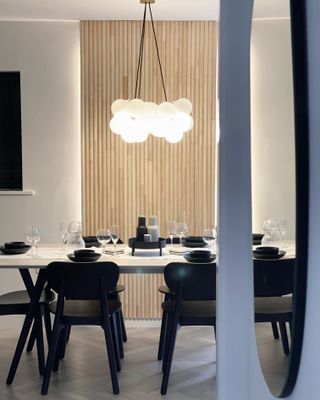 frosted glass pendant light over dining table