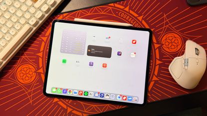 An iPad displaying iPadOS 27 laying on a desk