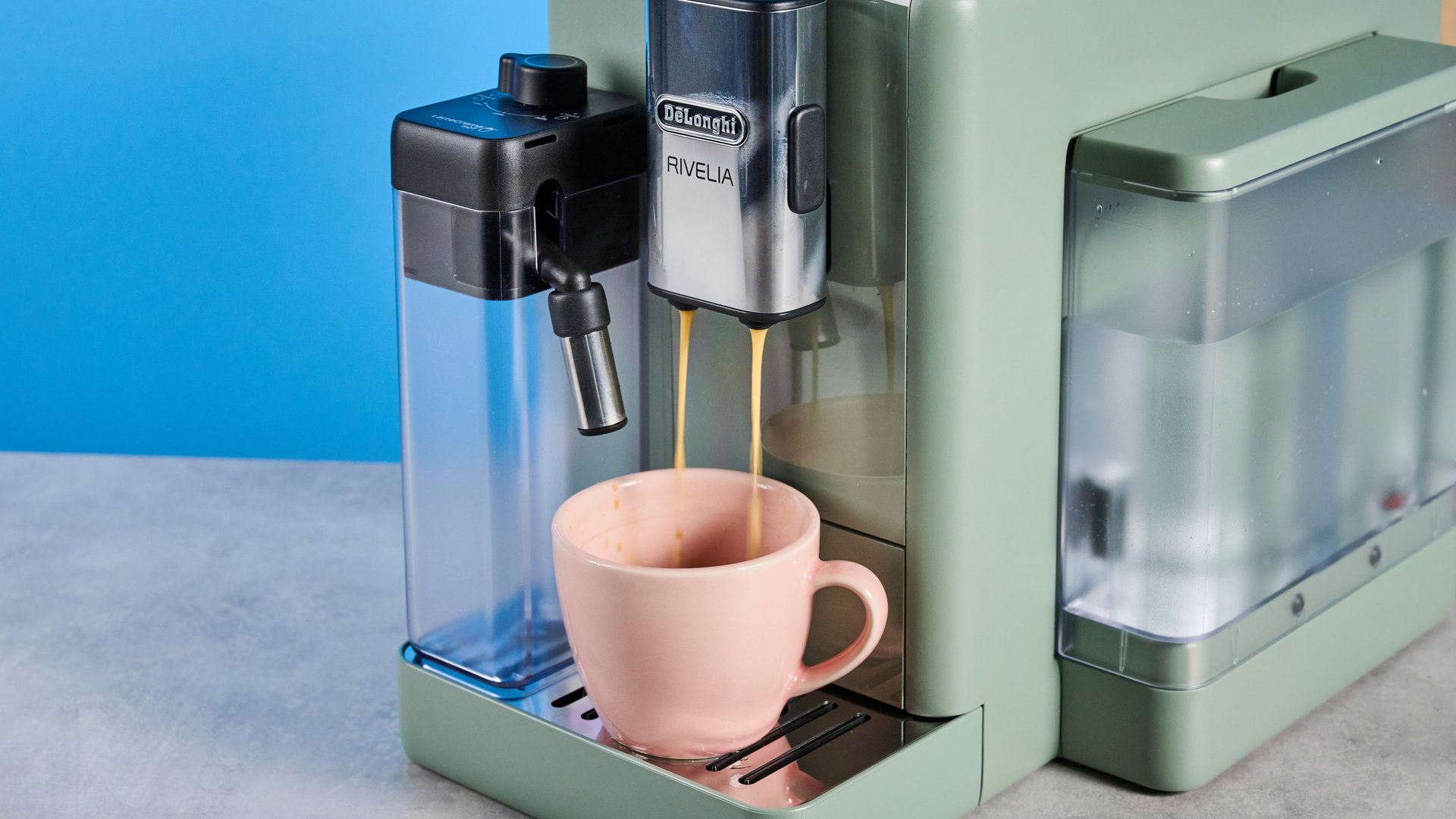 the de'longhi rivelia automatic superautomatic coffee machine in sage green with a bright LED screen, two interchangeable bean hoppers, an automatic milk frother, and a huge range of coffee recipes