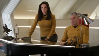 Rebecca Romijn as Una Chin-Riley / Number One and Anson Mount as Captain Christopher Pike in Star Trek: Strange New Worlds.