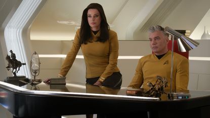 Rebecca Romijn as Una Chin-Riley / Number One and Anson Mount as Captain Christopher Pike in Star Trek: Strange New Worlds.