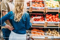 Couple in supermarket foo shopping