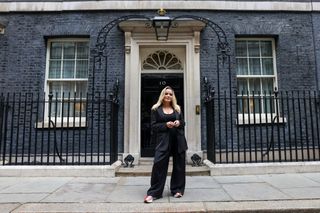 Author and podcast host Emily Clarkson outside 10 Downing Street