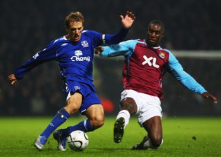 Everton's Phil Neville competes for the ball with West Ham's Carlton Cole in December 2007.