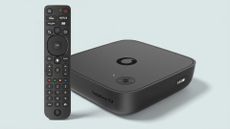 Vodafone TV box with remote on light green background